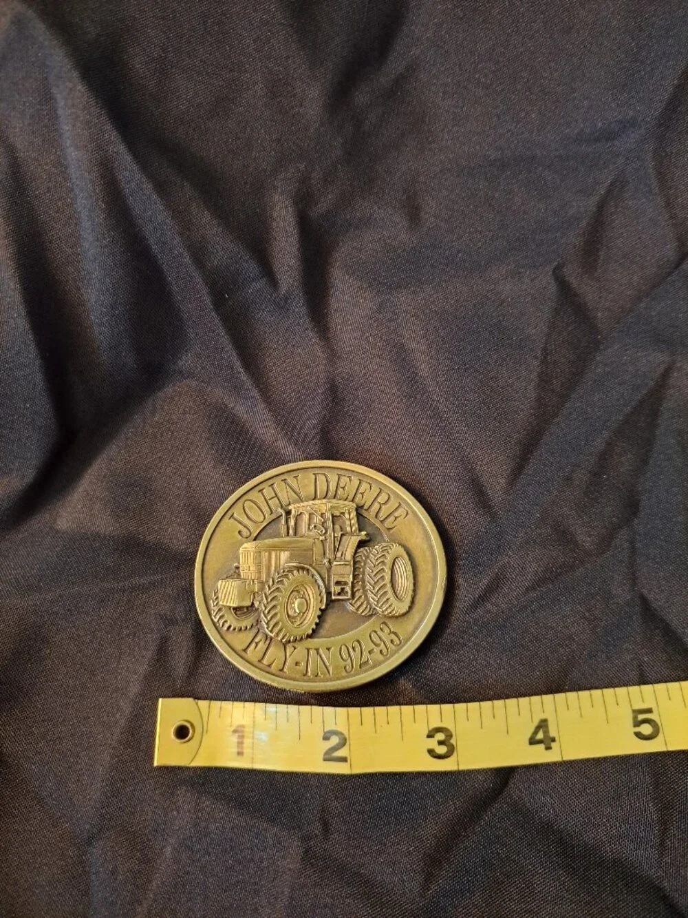 Vintage Bergamot Brass Works John Deere belt buckle with a 1992-93 Fly-In design